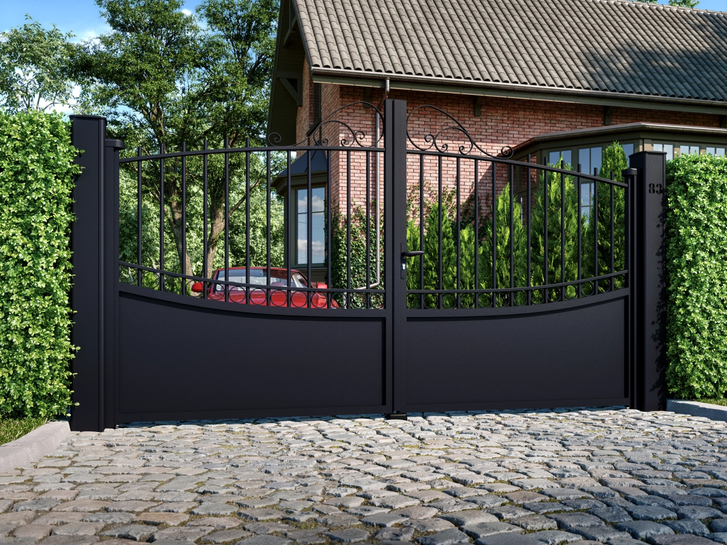 Portail noir deux vantaux volutes et barreaux devant maison briques et allée pavée
