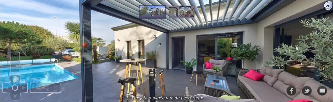 Pergola bioclimatique grise lames ouvertes, table haute ronde et salon gris à coussins roses